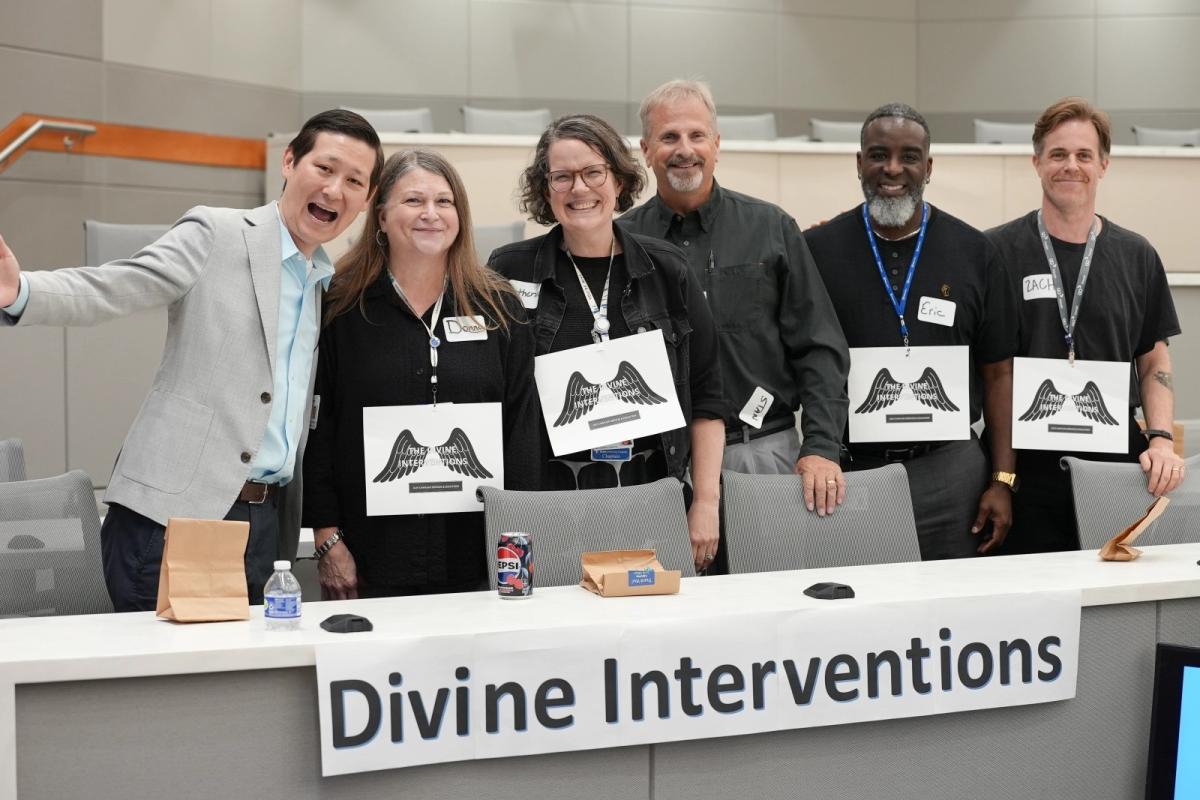 Five members of the chaplain's department and a game host